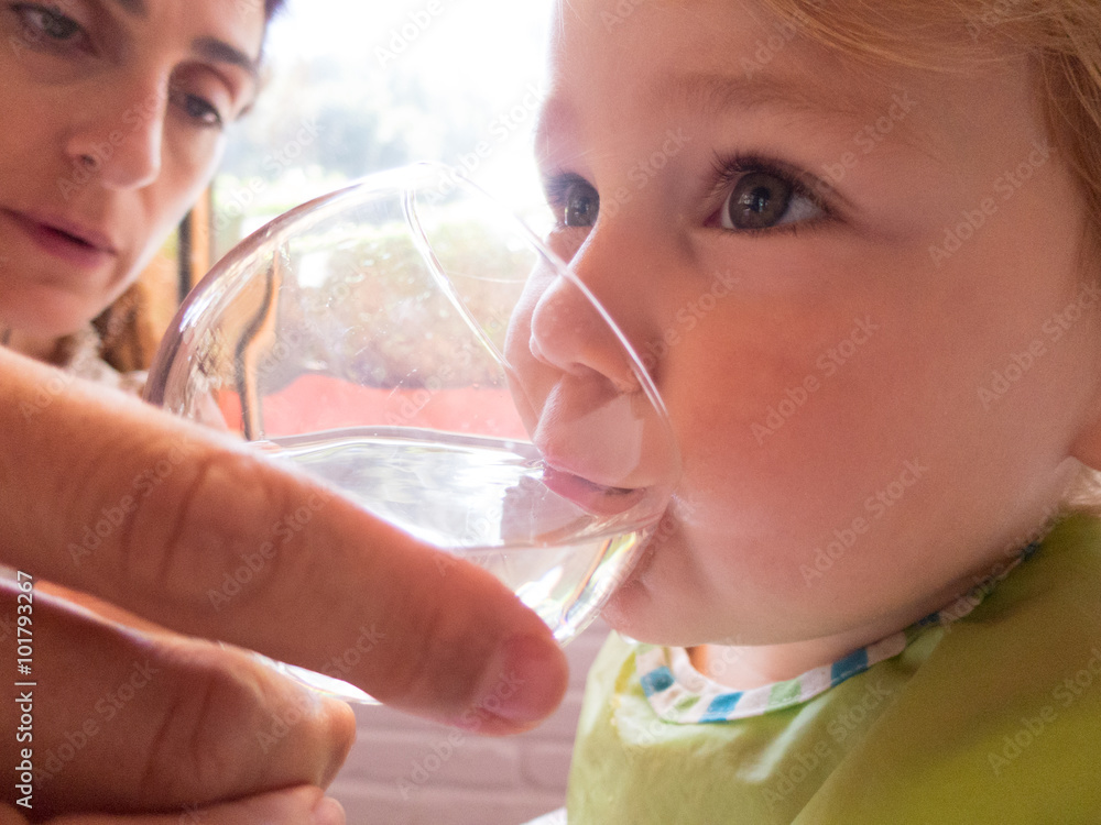 baby drinking water from mother hand baby drinking water from mother hand
