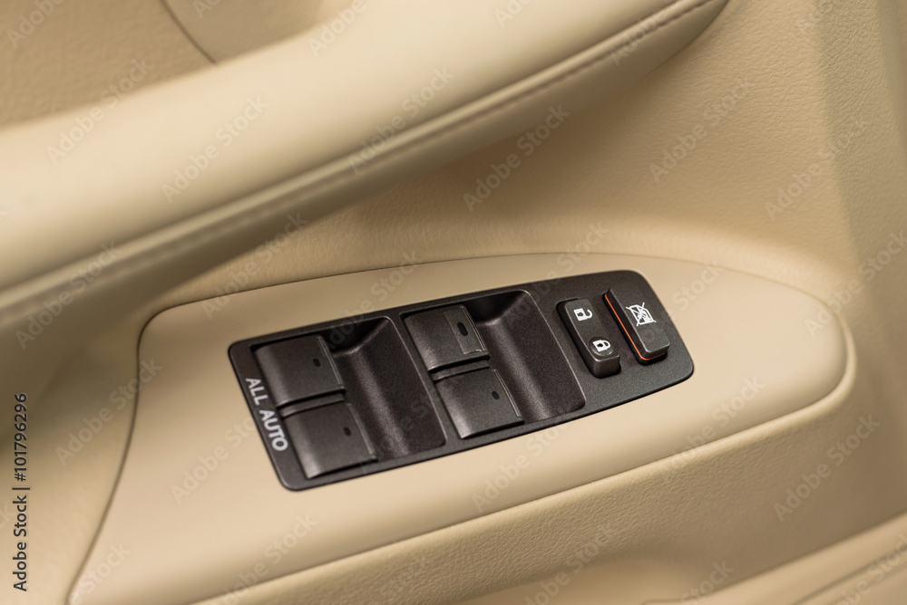 Modern car window control buttons. Interior details.