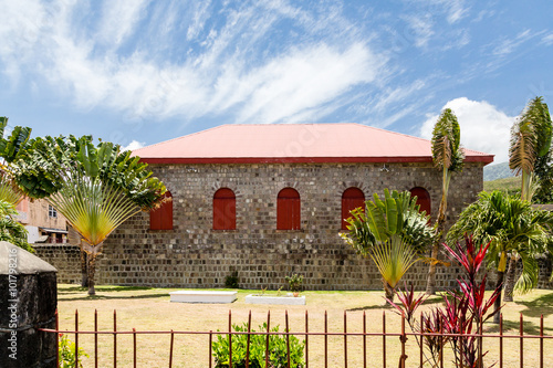 Red Shutters on Stone Building