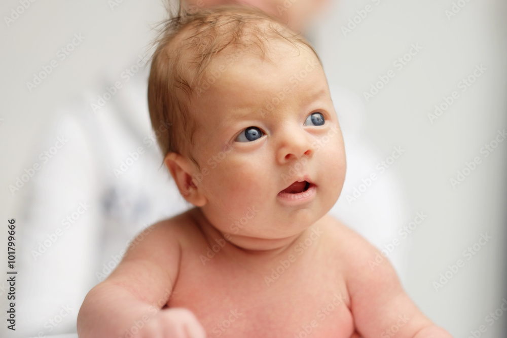 One month old newborn baby with mother One month old newborn baby with mother
