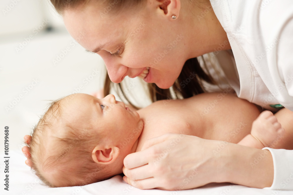 One month old newborn baby with mother One month old newborn baby with mother