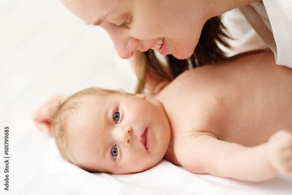 One month old newborn baby with mother One month old newborn baby with mother