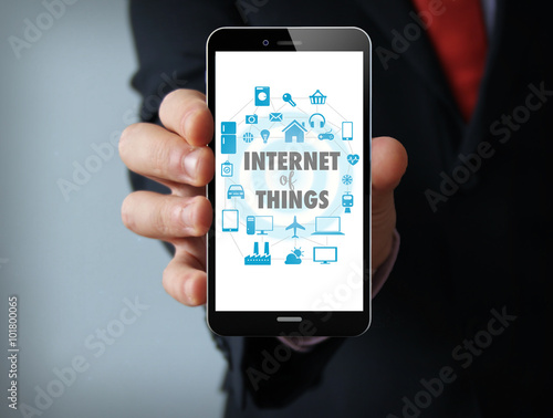 Internet of things graphic on the screen businessman smartphone