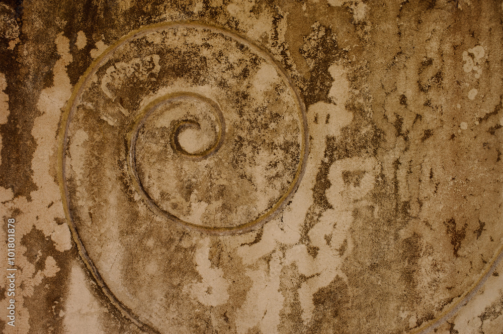 spiral on old beige plaster wall spiral on old beige plaster wall