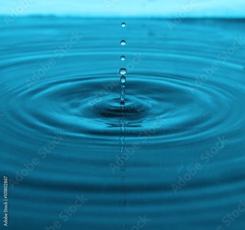 Waterdrop splashes into water