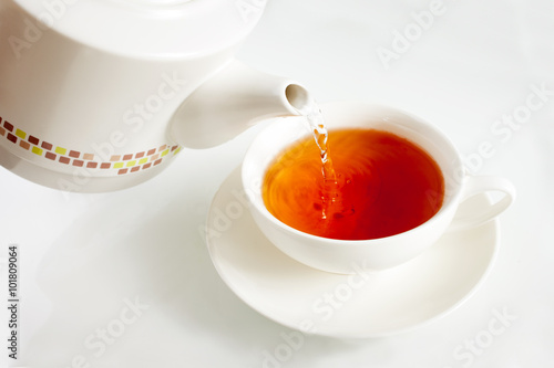 Pouring boiling water into a tea cup
