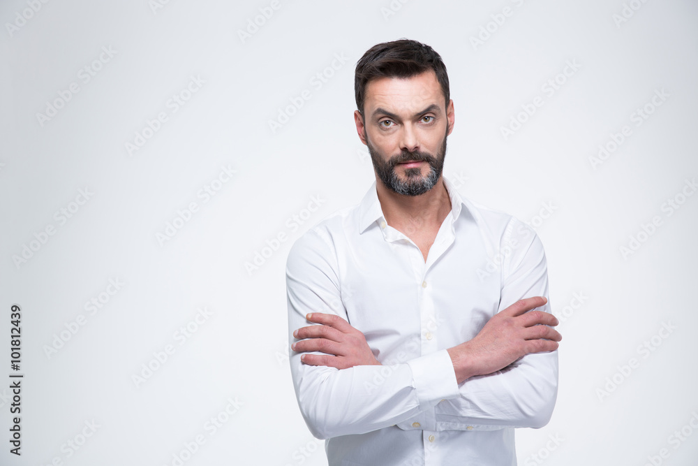 Businessman with arms folded looking at camera Businessman with arms folded looking at camera