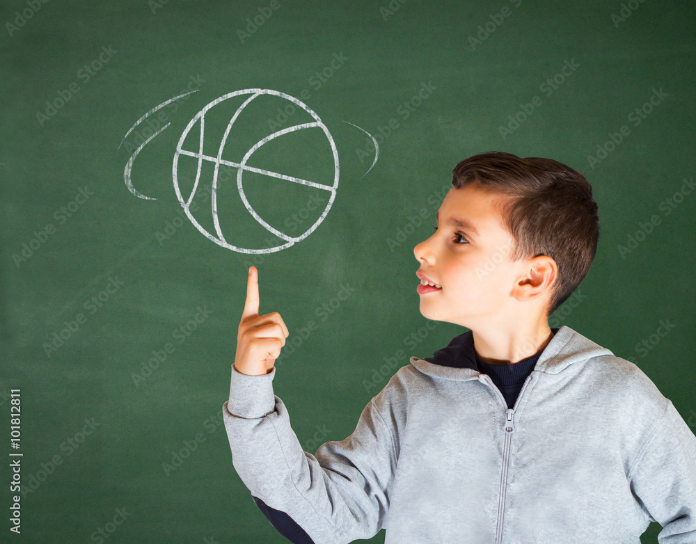 School boy with hand drawn basketball on green chalkboard