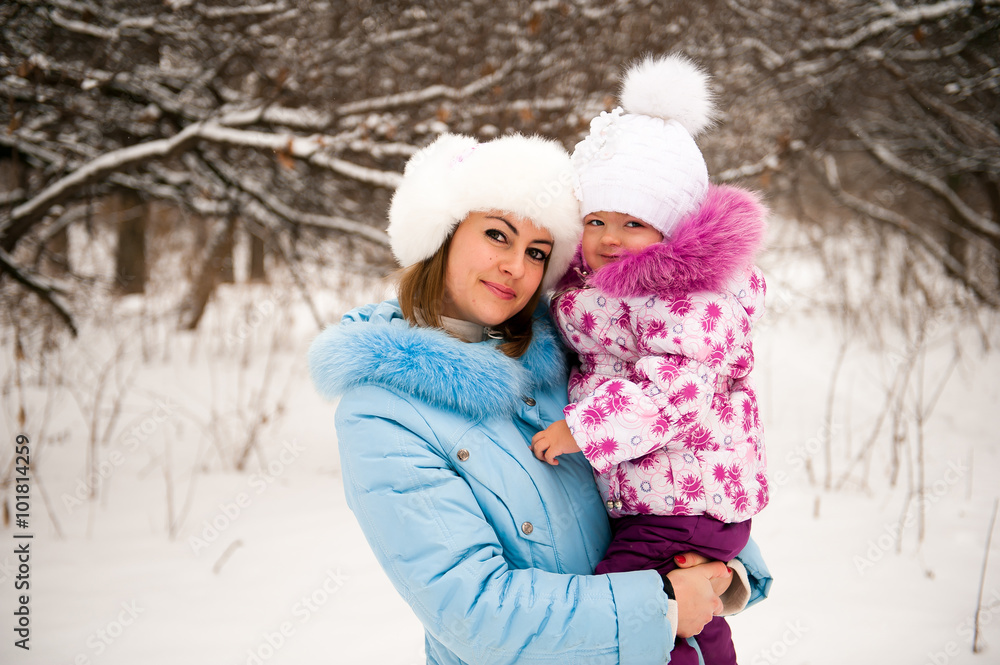 Mother and her little daughter enjoying beautiful winter day out Mother and her little daughter enjoying beautiful winter day out