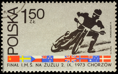 Motorcycle racer on postage stamp