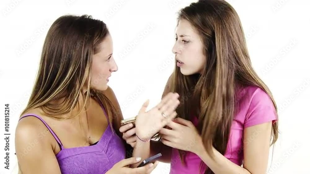 Girls discovering bad news reading text message on cell phone Girls discovering bad news reading text message on cell phone