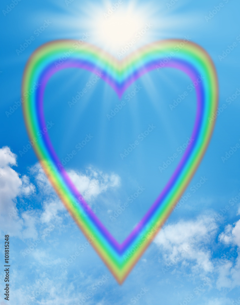 Rainbow love heart blue sky frame - a large empty rainbow shaped heart  creating a frame on