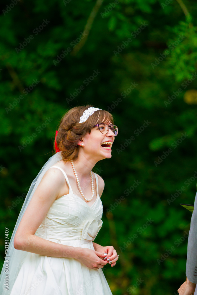 Naklejka premium Bride Laughing During Wedding Ceremony