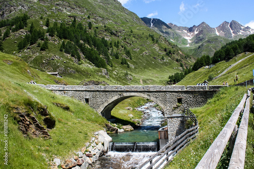 Bridge over mountain river photo