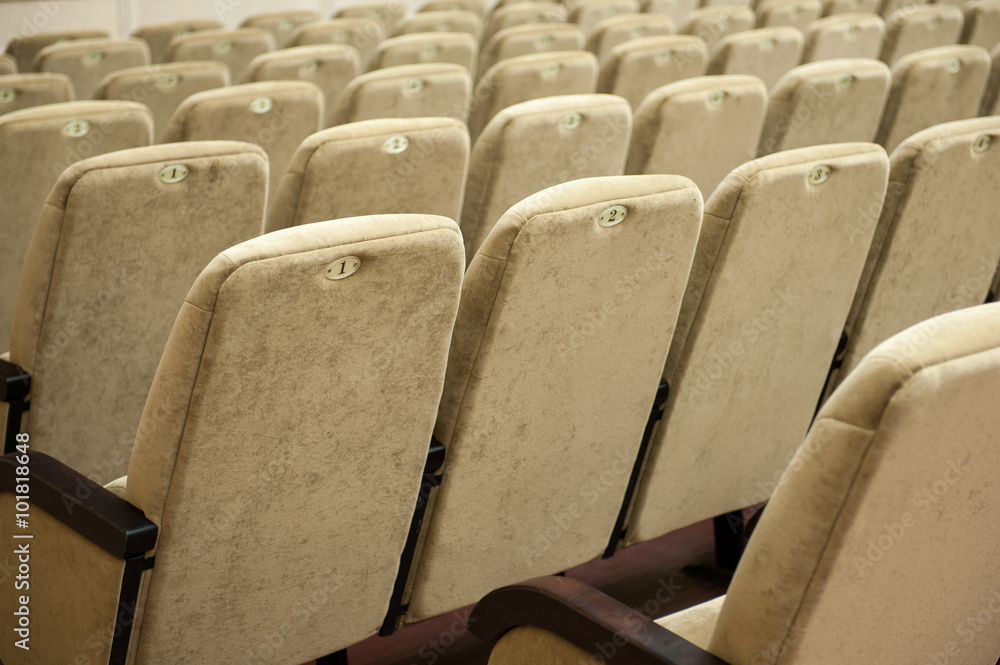 Fototapeta premium Empty auditorium with beige chairs, theatre or conference hall