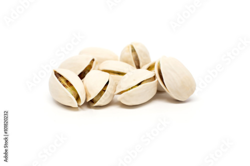 Salted pistachio nuts isolated on white background