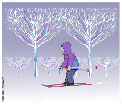 Little boy rides on skis in  Park winter.