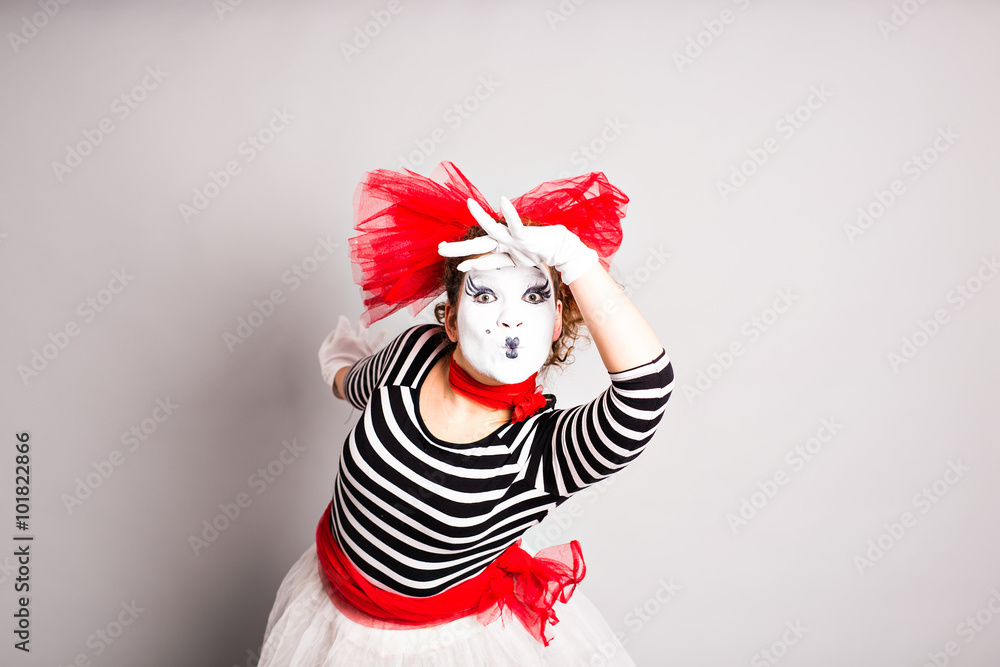 Portrait of a comedian  woman dressed up as a mime, April Fools Day concept