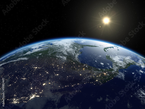 Earth from satellite. Beautiful sunrise over North America. Earth at night and in daytime.