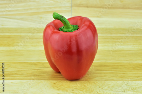 Sweet pepper on wood background