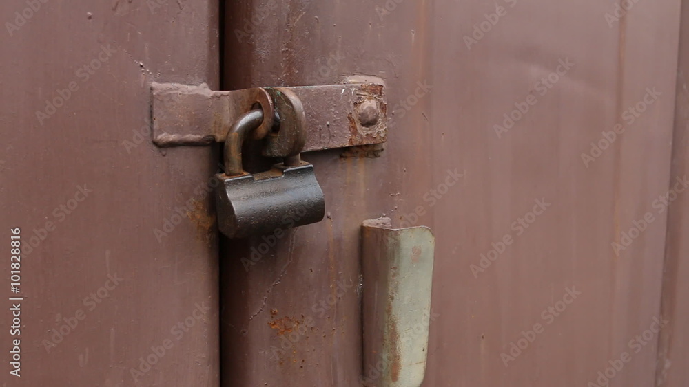 Old padlock on the door of the shed. Macro shot. Old padlock on the door of the shed. Macro shot.