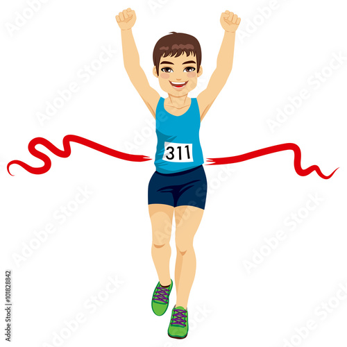 Male runner crossing red finish line and celebrating victory with fists up