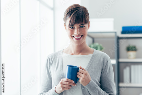 Woman having an hot coffee