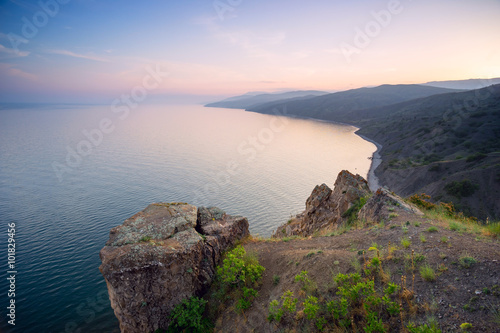 Mountain Cape Agira in the evening at sunset .