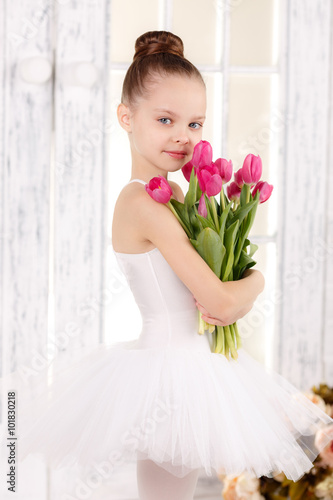 Принти на полотні beautiful little ballerina with a bouquet of pink tulips, March 8