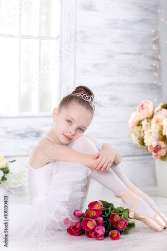 Canvastavla beautiful little ballerina with a bouquet of pink tulips, March 8