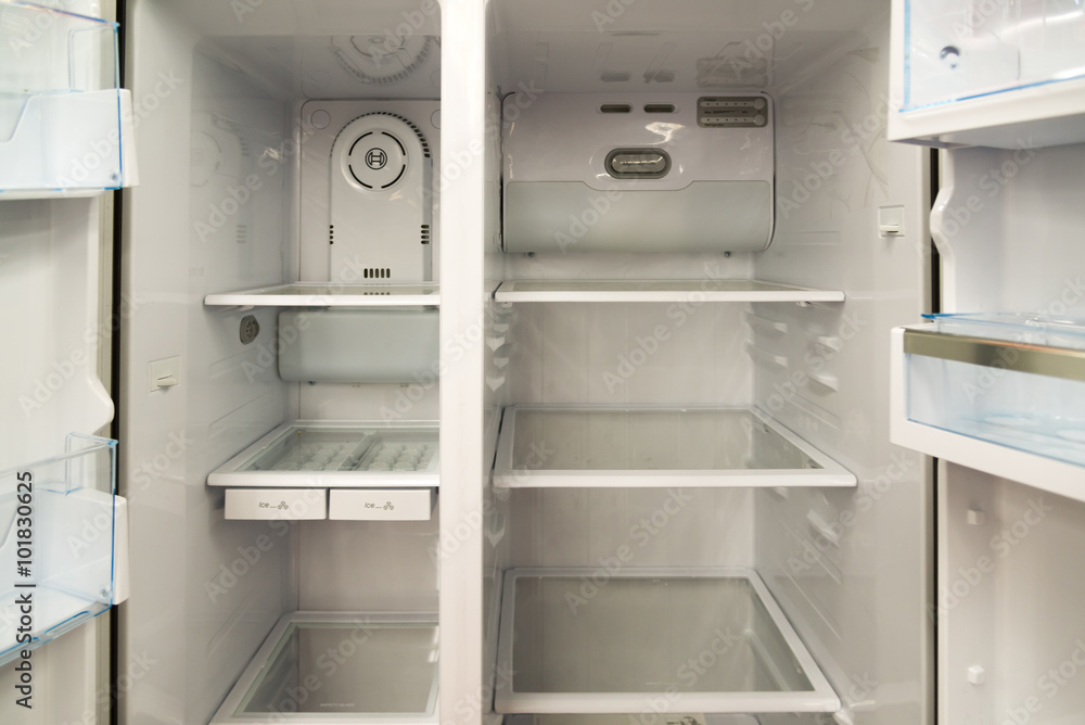 Open home refrigerator with empty shelves Open home refrigerator with empty shelves