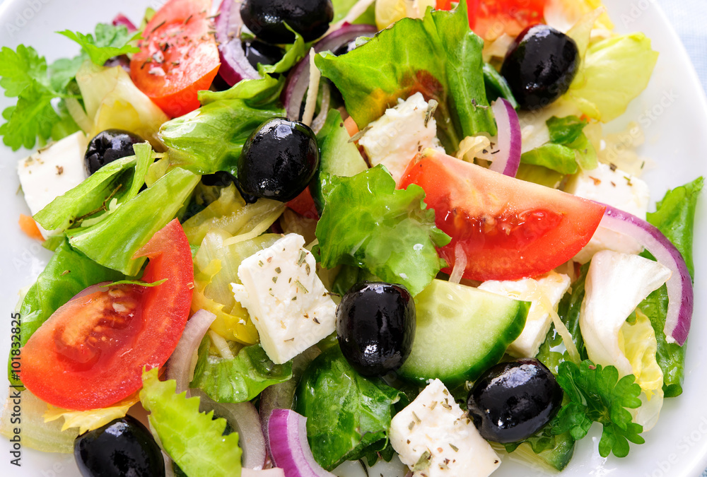 Greek salad isolated on white