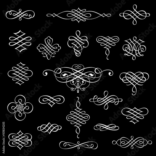 Fototapeta Naklejka Na Ścianę i Meble -  Vector calligraphic design elements isolated on black background