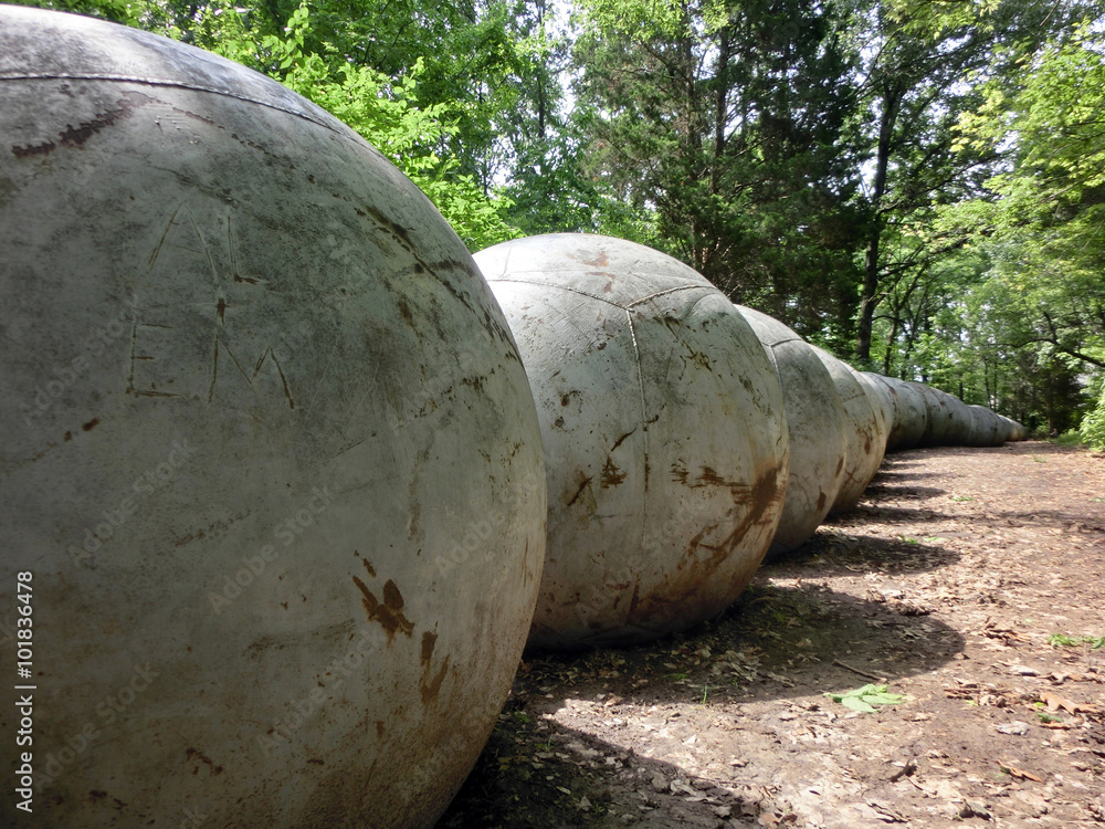 Concrete ball perspective in forest - landscape photo Concrete ball perspective in forest - landscape photo
