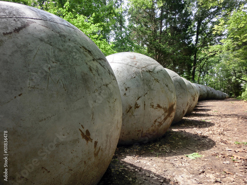 Concrete ball perspective in forest - landscape photo