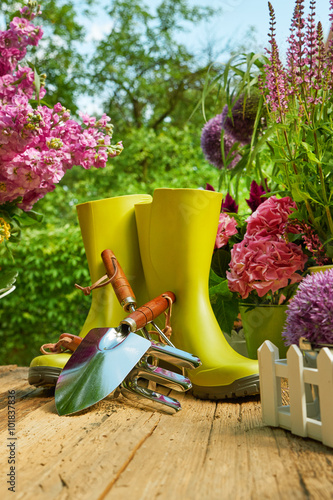 Outdoor gardening tools on old wood table  photo