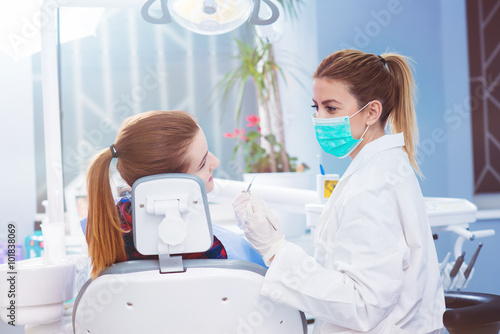 Dentist and patient at dentist office. Ready for surgery.