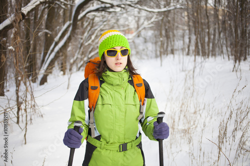 Girl in winter clothes with a backpack.