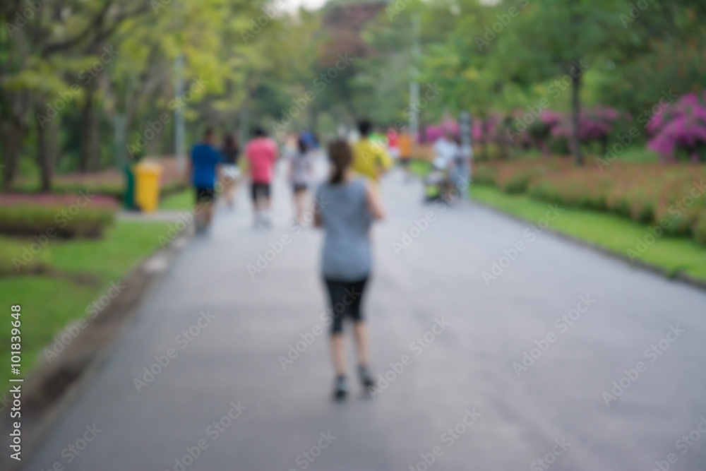 Blurred background of people running in park Blurred background of people running in park