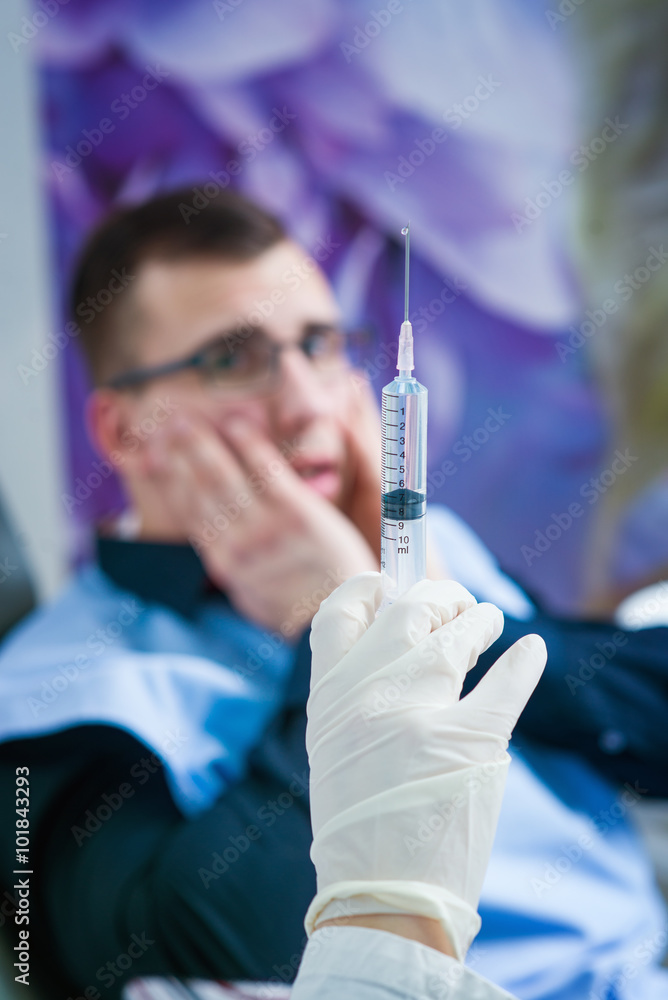 Vaccine at dentist office, shallow depth of field, scary patient in background. Vaccine at dentist office, shallow depth of field, scary patient in background.