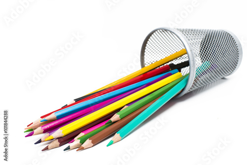 Colored pencils in a pencil case on white background photo