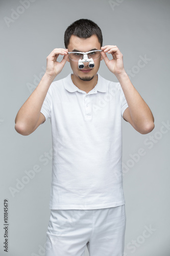 Doctor with binocular loupes