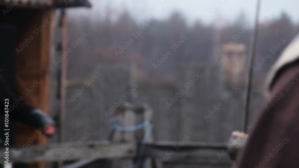 Brave warrior defending medieval village from enemy army attack, sword fight Brave warrior defending medieval village from enemy army attack, sword fight