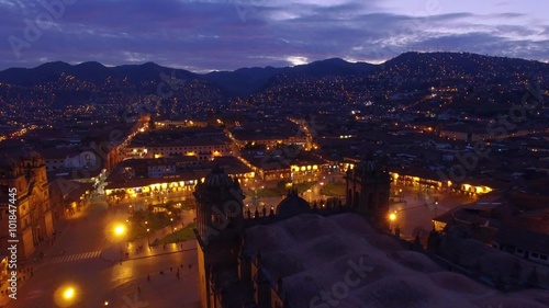 Flight over Cusco main square at blue hour photo