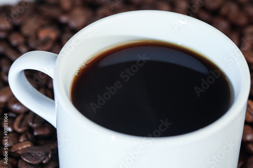 White Cup in Coffee Beans