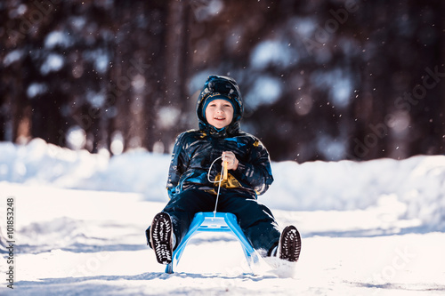 Little boy on a sled 