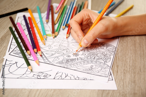 Adult antistress colouring book with pencils photo