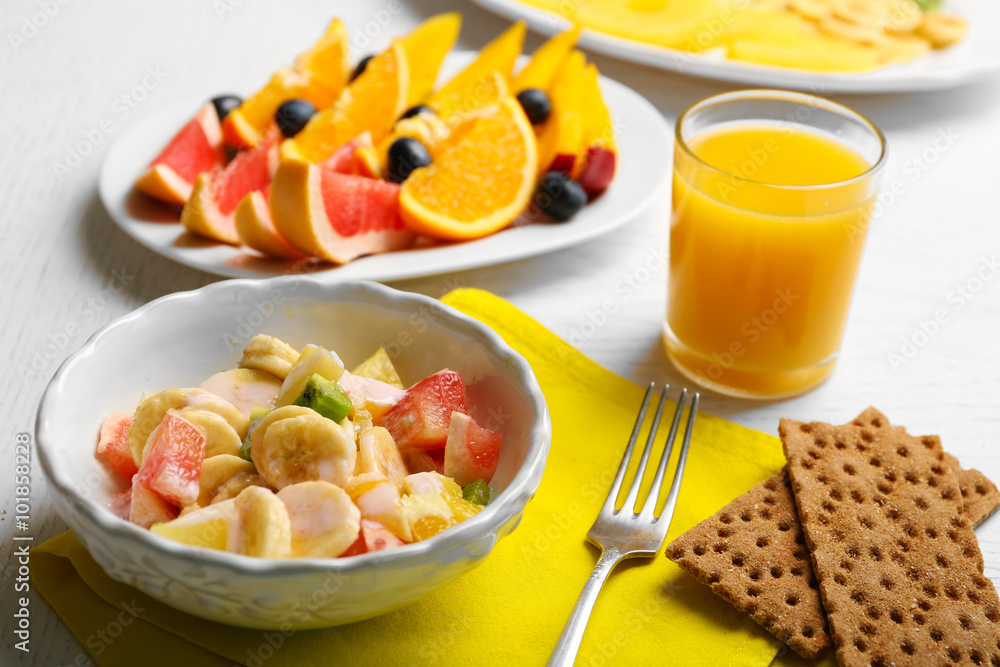 Fruit salad on wooden background. Healthy eating concept. Fruit salad on wooden background. Healthy eating concept.