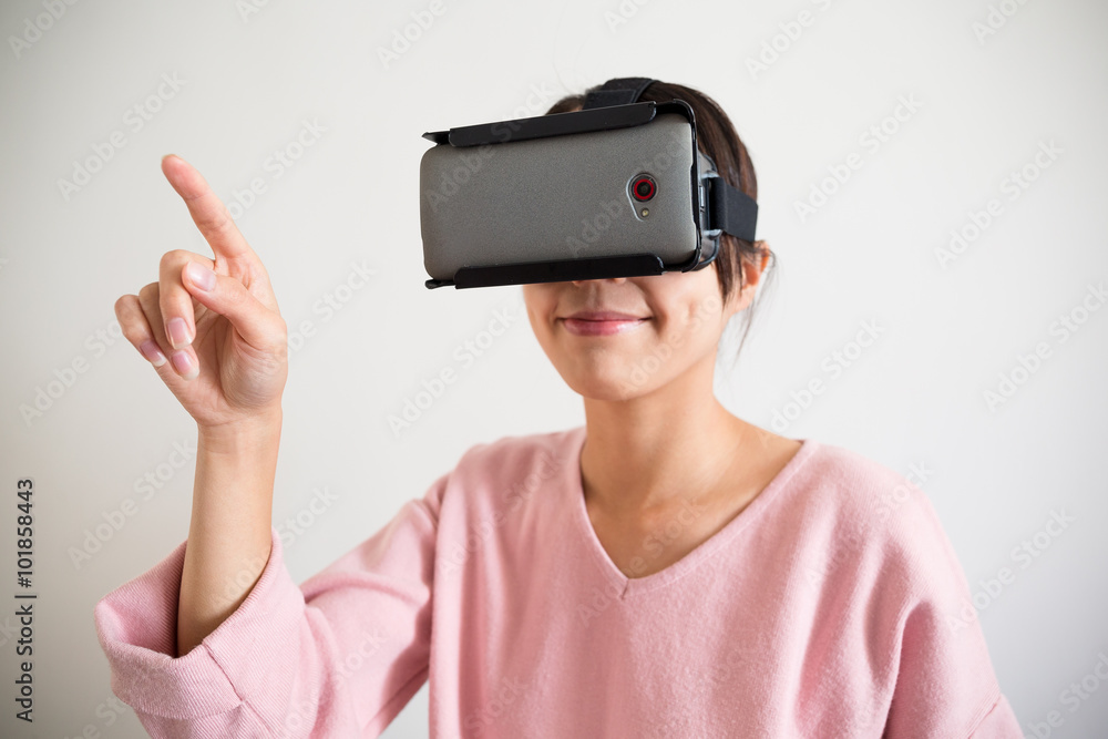 Woman touch on soemthing with vr device