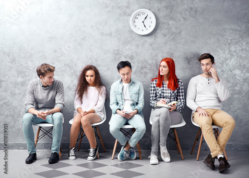 Young people sitting on a c...